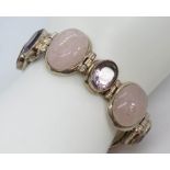 A substantial rose quartz bracelet, approx 22mm wide,