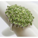 A superb silver and peridot cocktail cluster ring, stamped 925, size L-M.