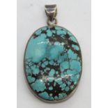 A large turquoise pendant of good teal blue colour with black veining,