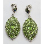 A large pair of peridot encrusted silver earrings, stamped 925, with butterfly backs, 6.
