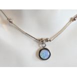 An opal and silver bead necklace in the Native American Navajo style, stamped 925 to pendant.