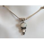 An opal and silver bead necklace in the Native American Navajo style,