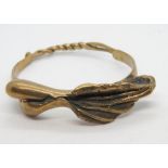 An unusual handcrafted copper bangle of naturalistic form, hinge and pin opening, 40.2g.