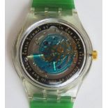An automatic Swatch watch in Earth Summit '92 pattern, within original packaging.