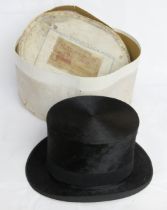 A black silk top hat having London makers mark to lining, in Rawcliffes Ltd box, size 6 7/8.