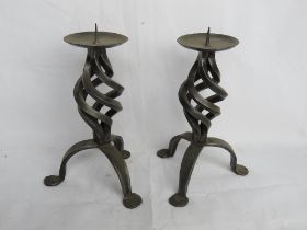 A pair of large tabletop iron work candle stands.