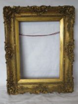 A large gilt and wood composite picture frame, 72 x 57cm.