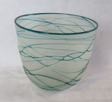 A clear and blue glass plant pot.