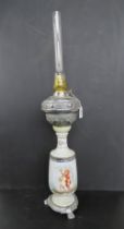A large late 19th century French ceramic and chrome oil lamp with glass chimney having classical