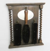 An Edwardian hall mirror with brushes, barley twist column to each side.