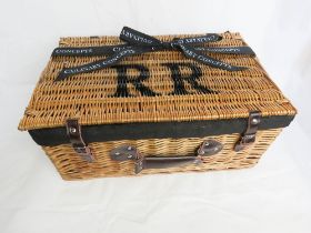 A Culinary Concepts for Rolls Royce picnic hamper with leather straps and black fabric lining.