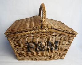 A Fortnum & Mason Huntsman picnic hamper.