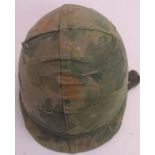 A Korean War era US M1 helmet with Vietn