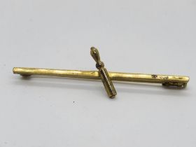 A yellow metal bar brooch, unknown Arabic? mark upon, 3.9g.