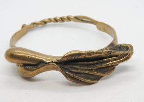 An unusual handcrafted copper bangle of naturalistic form, hinge and pin opening, 40.2g.