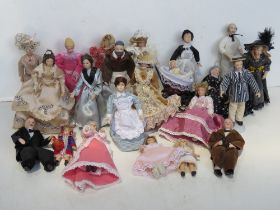 A quantity of soft body ceramic faced dolls house figures.