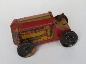 A tin-plate clockwork toy made by MAR Taoy Great Britain.