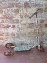 A vintage metal scooter.