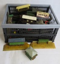 A quantity of Hornby model train carriages, track, platforms etc by Meccano.