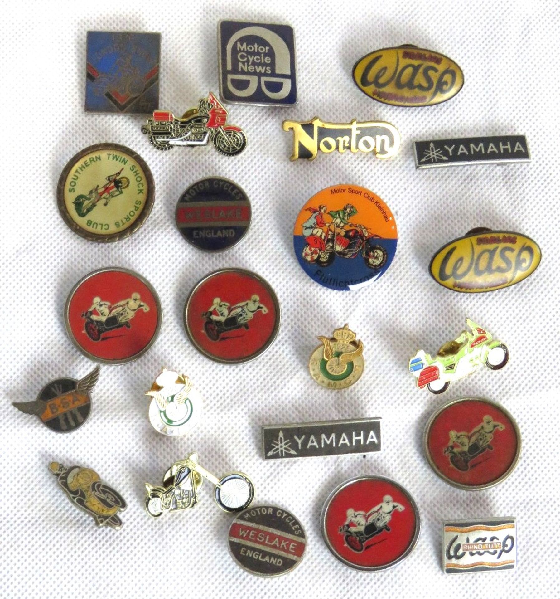 A quantity of assorted motorbike themed pin badges including BSA, Yamaha, Norton,