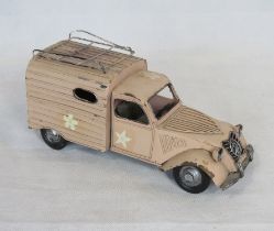 A contemporary large scale metal model of a VW van.