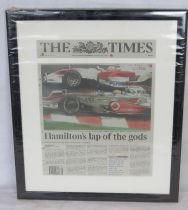 A framed F1 themed newspaper article 'Hamiltons lap of the gods'.