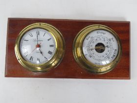 A Spectrum Weathermaster clock and barometer mounted on wooden board 34cm wide.