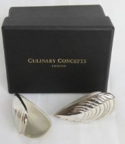 A pair of as new in box Culinary Concepts mussel eaters.