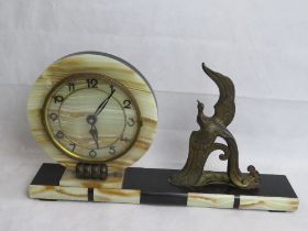An Art Deco onyx and marble mantle clock having decorative cast metal phoenix upon.
