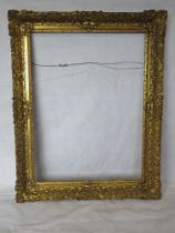 A large gilt and wood composite picture frame, 58 x 74cm.