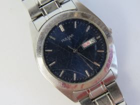 A stainless steel Pulsar wrist watch having blue dial with day and date apertures, V733-X070.