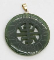 A jade pendant having 14ct gold bale, stamped 14k, approx 3cm dia.