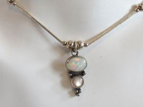 An opal and silver bead necklace in the Native American Navajo style,