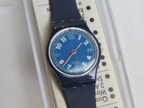 A Swatch watch in Forsail pattern, incorrect packaging, new battery within box.