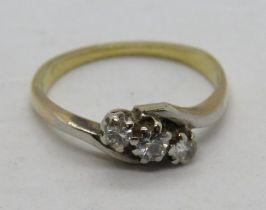 A three stone diamond ring, hallmarks worn, size J-K, 2.1g.