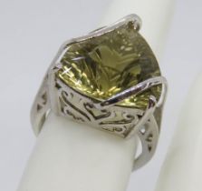 A silver solitaire cocktail ring having pierced gallery and triform stone, stamped 925, size O.