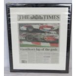 A framed F1 themed newspaper article 'Hamiltons lap of the gods'.