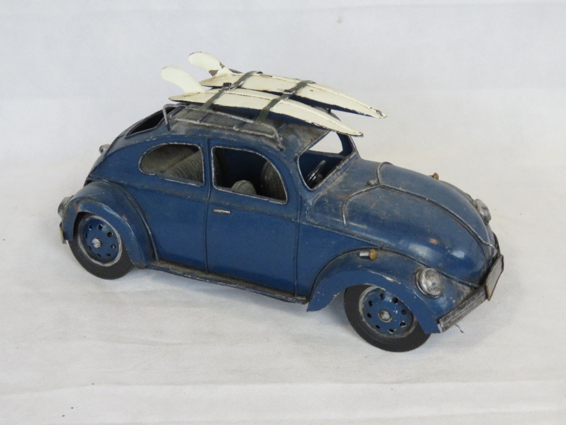 A contemporary large scale metal model of a VW Beetle.