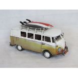 A contemporary large scale metal model of a VW Camper van.