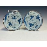 A PAIR OF JAPANESE ARITA BLUE AND WHITE SHALLOW BOWLS, EACH PAINTED WITH TWO CRANES FLYING AMONGST