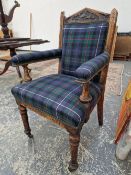 A TARTAN UPHOLSTERED OAK ELBOW THE COPPER PLAQUE INSET BELOW THE TRIANGULAR TOP RAIL INSCRIBED