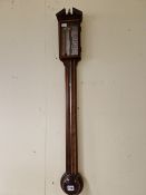 A COMITTI LINE INLAID MAHOGANY STICK BAROMETER WITH AN ALCOHOL THERMOMETER TO ONE SIDE OF THE