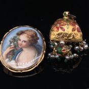 AN ANTIQUE HAND PAINTED OVAL PORTRAIT MINIATURE BROOCH CONVERSION OF A MAIDEN HOLDING FLOWERS, THE