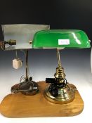 TWO BRASS ADJUSTABLE DESK LAMPS, ONE WITH A GREEN GLASS SHADE AND THE OTHER WITH A BRASS SHADE.