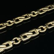 A FANCY FLAT LINK CHAIN. UNHALLMARKED, ASSESSED AS 9ct GOLD. LENGTH 60.5cms. WEIGHT 21.9grms.