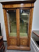 A 19th C. MARQUETRIED WALNUT DISPLAY CABINET, THE BASES OF THE TWO GLAZED DOORS WITH FLORAL