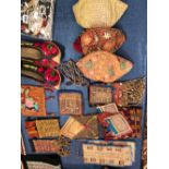 A COLLECTION OF ETHNIC BAGS, SKULL CAPS, A PAIR OF SHOES AND TWO PANELS