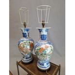 A PAIR OF CHINESE BALUSTER VASES AS LAMPS, EACH PAINTED WITH FAMILLE VERTE RESERVES OF A DRAGON