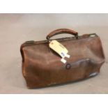 A PEAL & CO LEATHER GLADSTONE BAG, A LEATHER SUITCASE, THE LID. 43 x 35cms. TOGETHER WITH A BLACK