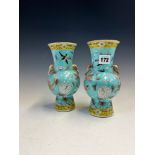 A PAIR OF CHINESE TURQUOISE GROUND BALUSTER VASES PAINTED WITH DRAGONS, BIRDS AND FLOWERS ABOUT